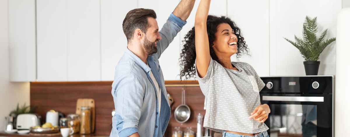 couple dancing in kitchen remodel