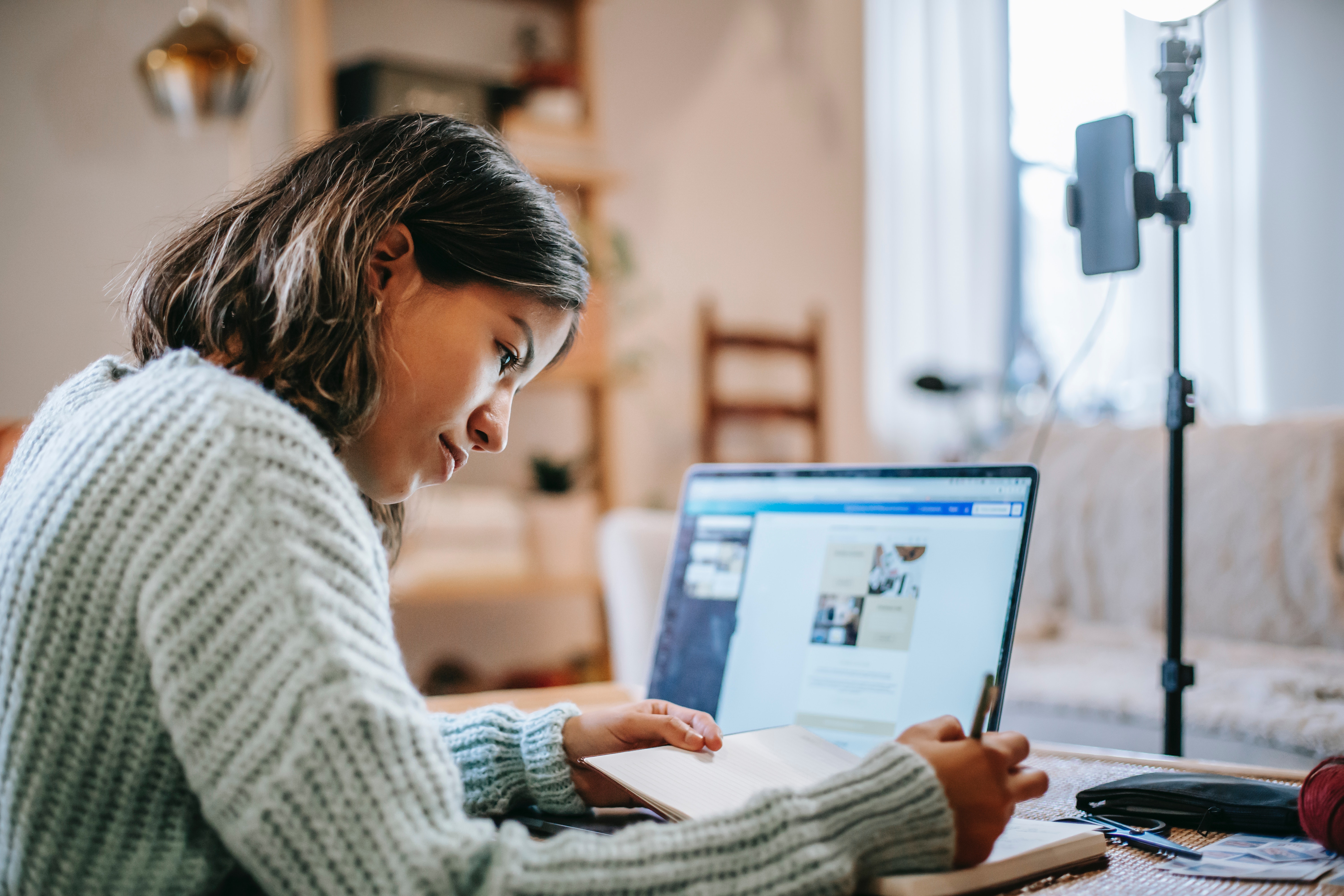 woman with laptop creating a business plan